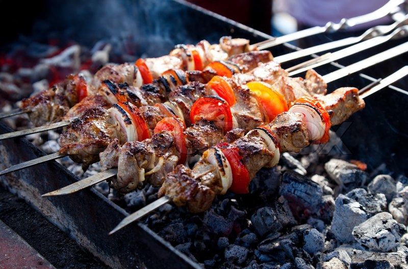 9862 1820701 juicy slices of meat with sauce prepare on fire shish kebab